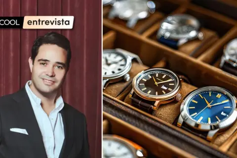 Entrevista sobre qué es el mercado gris, con un hombre en traje y una caja de relojes de lujo.