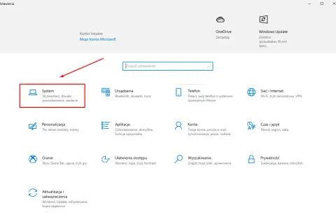 Ekran ustawień Windows z zaznaczoną opcją "System" i ikoną komputera.