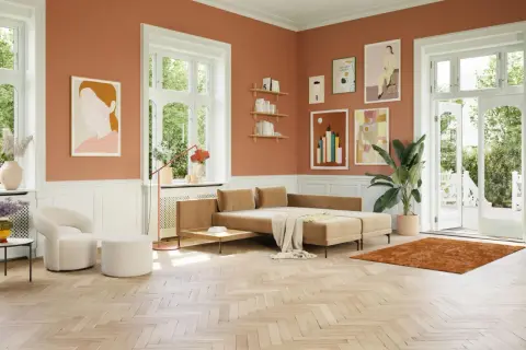 Ein Wohnzimmer mit orangefarbenen Wänden. Ein beiger Teppich und ein Sofa, welche farbe passt zu orange? Weiß und Beige harmonieren perfekt.