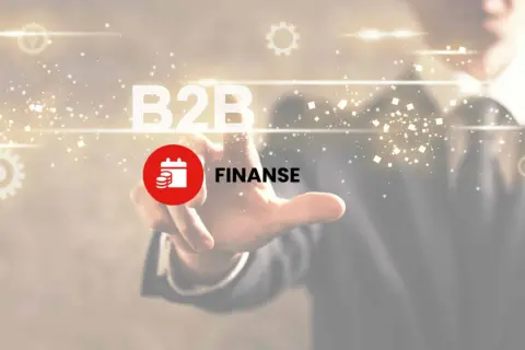 Dłoń dotyka ekranu z napisem B2B i ikoną finansów. To klucz do zrozumienia, b2b co to jest.