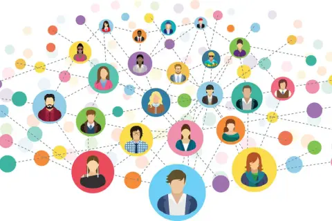 Wielobarwna sieć połączeń między ikonami ludzi symbolizuje networking i budowanie relacji.