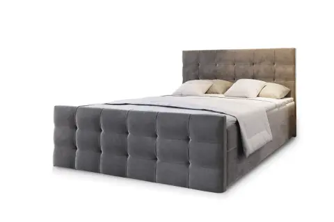 Szare, pikowane łóżko kontynentalne z dwoma poduszkami i narzutą. To kwintesencja komfortu i stylu.