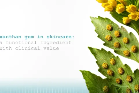 Xanthan Gum in Kosmetik: Ein funktioneller Inhaltsstoff mit klinischem Wert, dargestellt durch eine grüne Pflanze mit gelben Blüten und Sporen.