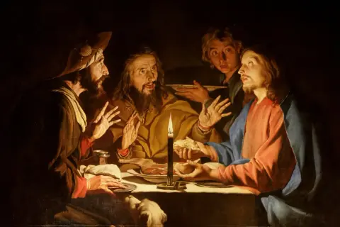 Droga do Emaus: przy świecy Jezus łamie chleb z zaskoczonymi uczniami, którzy rozpoznają Go dopiero teraz.