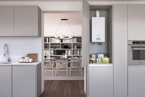 Calentador estanco blanco instalado en un armario de cocina moderno, junto a un horno.