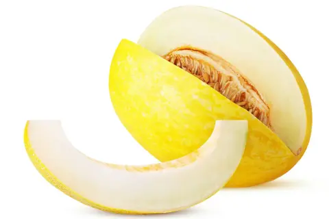 En saftig honungsmelon, skuren för att visa dess frön. Perfekt för en lätt och hälsosam snack med lågt honungsmelon kcal-innehåll.