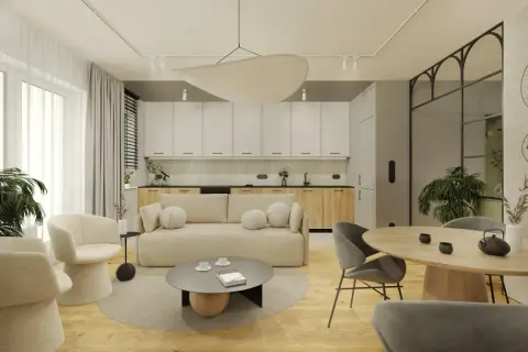 Nowoczesny salon z aneksem kuchennym, jasna sofa, okrągły stół, designerskie fotele i rośliny.
