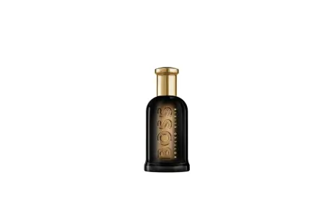 Elegancka butelka perfum Hugo Boss Bottled Oud Elixir z ciemnego szkła i złotym korkiem.
