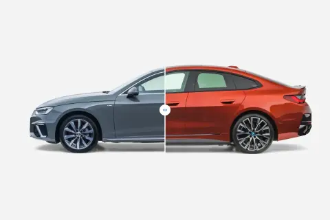 Porównanie wymiarów samochodów osobowych: szare Audi i pomarańczowe BMW.