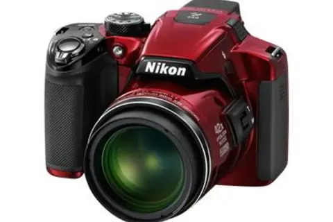 A red Nikon P510 camera with a large lens, ready to capture any adventure.