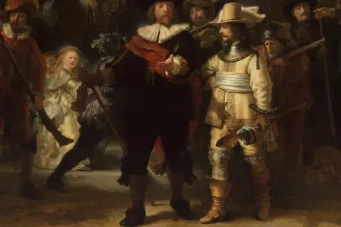 Rembrandt, najpopularniejsze obrazy: "Straż nocna" ukazuje grupę uzbrojonych mężczyzn i dziewczynkę w jasnej sukni, w dynamicznej scenie.