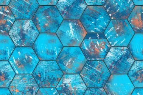 Carrelage écologique hexagonal aux teintes bleues et orangées, évoquant une texture usée et artistique.