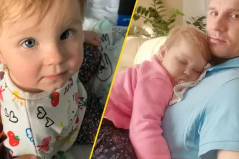 Dziecko z niebieskimi oczami i śpiące na ramieniu taty. To uroczy zespół.