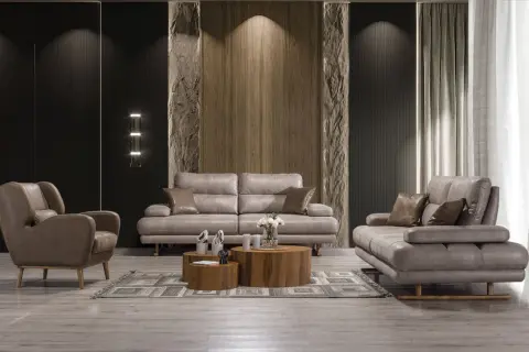 Modern vardagsrum med grå lädersoffa och fåtölj. Perfekt soffa inspiration för ett stilrent hem.