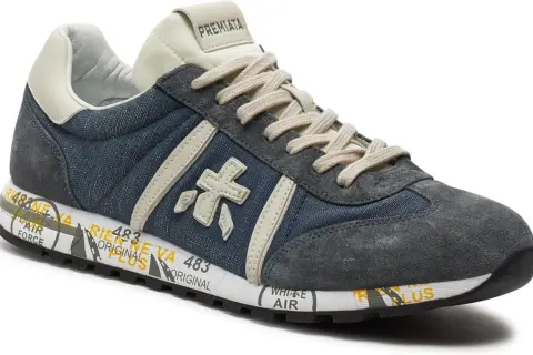 Buty Premiata, znana włoska marka, prezentują stylowe sneakersy z denimu i zamszu.