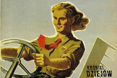 Kobieta za kierownicą, w stylu radzieckich plakatów propagandowych. Uśmiechnięta, z czerwoną chustą na szyi, symbolizuje postęp i siłę.