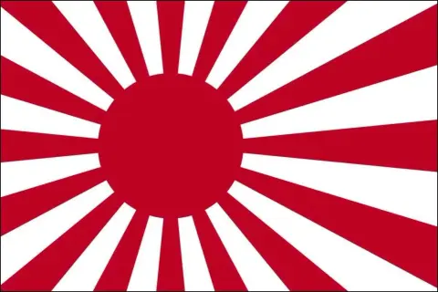 Flaga Japonii z czerwonym słońcem i promieniami.