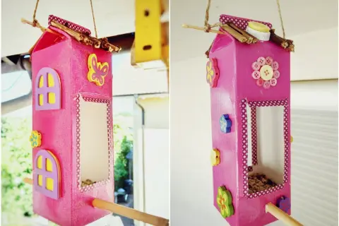 Ein süßes haus aus milchkarton basteln: bunte Blumen, Schmetterlinge und Knöpfe zieren dieses DIY-Vogelhaus.