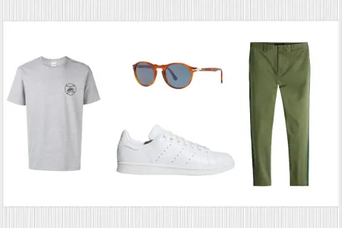 Outfit con t-shirt grigia, occhiali da sole tartarugati, pantaloni verdi e le iconiche Adidas Stan Smith, un classico intramontabile.