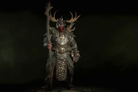 Potężny diablo 2 druid w zbroi z rogami jelenia, trzymający kostur.