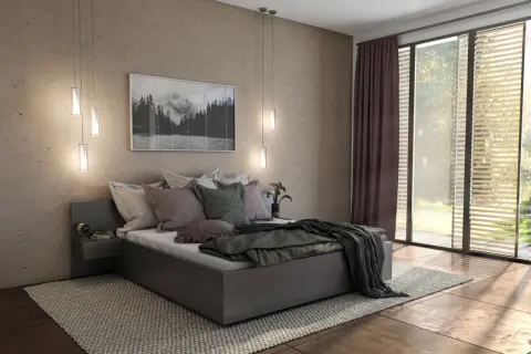 Gemütliches Schlafzimmer mit einem modernen Polsterbett, das zum Entspannen einlädt. Ein Bild mit Berglandschaft und viel Tageslicht.