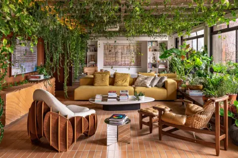 A living room embracing organic architecture, with lush plants cascading from the ceiling and filling the space, creating a vibrant, natural sanctuary.