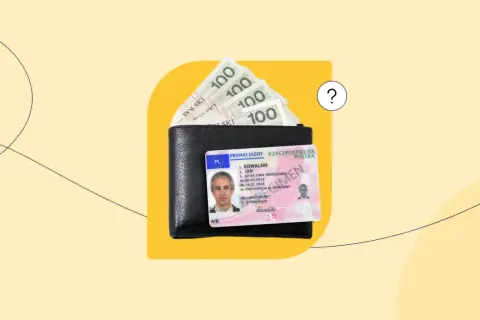 Portfel z polskim prawem jazdy i banknotami 100 zł.