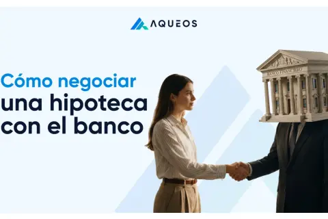 Una mujer estrecha la mano a una figura con un banco en la cabeza. El texto dice "Cómo negociar una hipoteca con el banco".