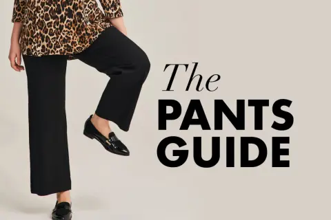 Kobieta w czarnych spodniach plus size i bluzce w panterkę, obok napis "The PANTS GUIDE".