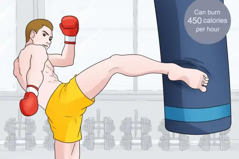 A man in boxing gloves and yellow shorts performs a powerful kick against a large blue punching bag. This speed bag workout can burn 450 calories per hour.
