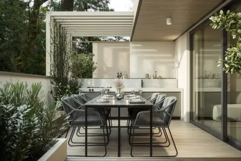 Moderne terrasse gestalten mit Essbereich und Außenküche, umgeben von üppigem Grün. Perfekt für entspannte Abende.