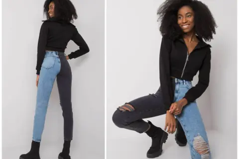 Modne stylizacje z jeansami: dwukolorowe spodnie i czarna bluza z zamkiem.