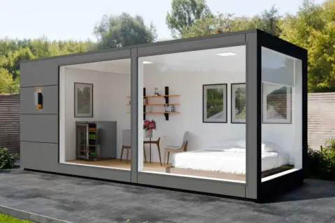 Modernes Container Haus mit Bett, Kühlschrank und Sitzbereich. Informieren Sie sich über die Container haus kosten für Ihr Traumhaus.
