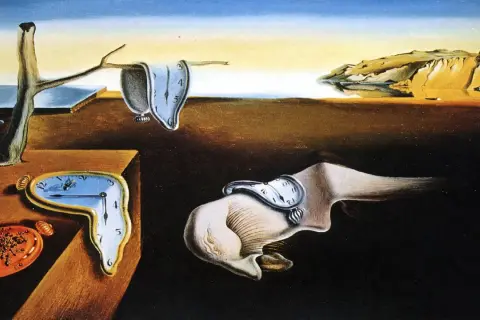 Płynące zegary na pustynnym krajobrazie, symbolizujące ulotność czasu. To kwintesencja surrealizmu co to.