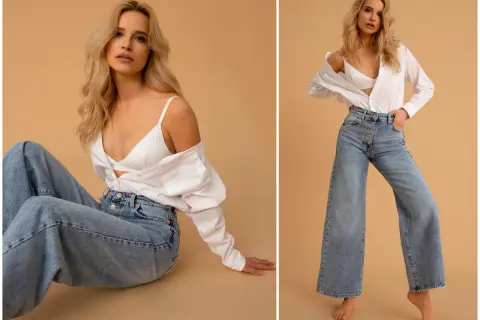 Modne szerokie jeansy i biały top to styl, który jest teraz modny.