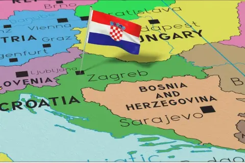 Chorwacja nad jakim morzem? Mapa pokazuje Chorwację z flagą, sąsiadującą ze Słowenią i Bośnią i Hercegowiną, nad Adriatykiem.