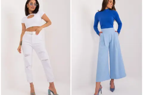 Dwie kobiety prezentują luźny, elegancki styl damski. Jedna w białym crop topie i podartych jeansach, druga w niebieskim golfie i szerokich, błękitnych spodniach.