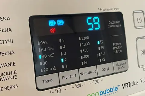 Wyświetlacz pralki Samsung z ikonami: bęben, wirowanie, wyciszenie. Czas 59 minut.