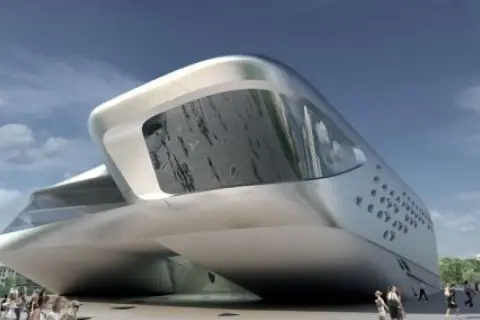 Futurystyczny budynek w kształcie łodzi, dzieło Zaha Hadid, lśni w słońcu. Ludzie spacerują przed jego niezwykłą fasadą.