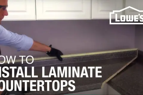 Learn how to install laminate countertops with this helpful guide. A person in gloves is shown working on a countertop.