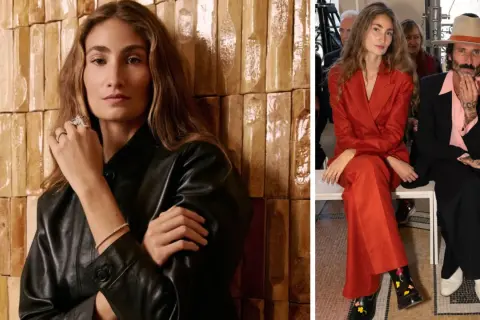 Almudena Cañedo, elegante en traje rojo, y un hombre con sombrero y traje negro, sentados en un evento.