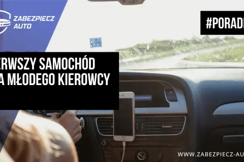 Pierwszy samochód dla młodego kierowcy. Widok z perspektywy kierowcy na deskę rozdzielczą, telefon na uchwycie i drogę przed autem.