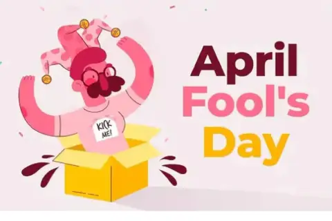 Un personaje con gorro de bufón sale de una caja amarilla, con un cartel que dice "Kick Me!". Es una ilustración de que es April Fools' Day.