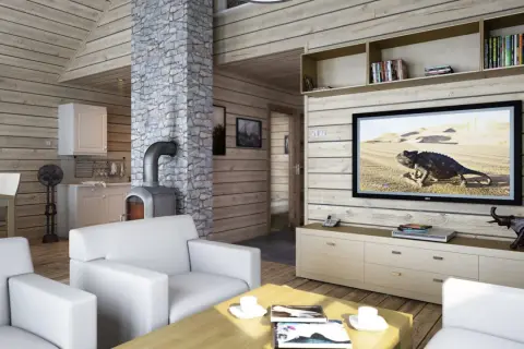 Przytulny domek letniskowy aranżacja wnętrza: białe sofy, kamienny kominek, kuchnia i salon z TV.