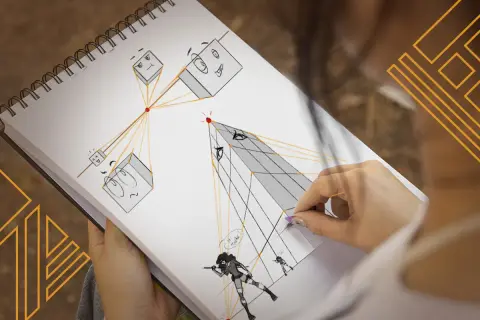 Une main dessine des cubes expressifs et une pyramide dans un carnet, explorant une **idée photo perspective** avec des lignes de fuite.