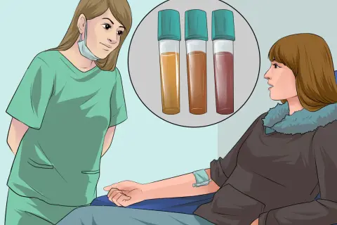 Une infirmière observe trois tubes de sang après une piqure.