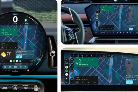 Nowoczesny kokpit z nawigacją i muzyką, pokazujący funkcje android auto na telefonie.