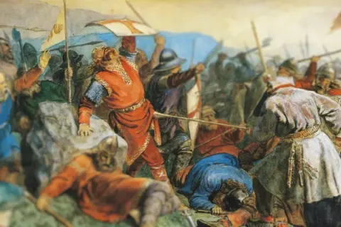 Una batalla épica con guerreros vikingos. Un hombre con túnica roja, quizás Olaf el Santo, lidera la carga.
