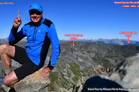 Randonneur souriant au sommet du Pic de Peyreget, point de départ du Grand Tour du Pic du Midi d'Ossau. Paysage montagneux spectaculaire.
