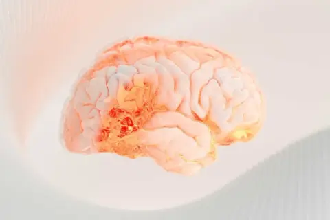 En lysande hjärna med glödande områden, som symboliserar effekten av serotonin medicin.